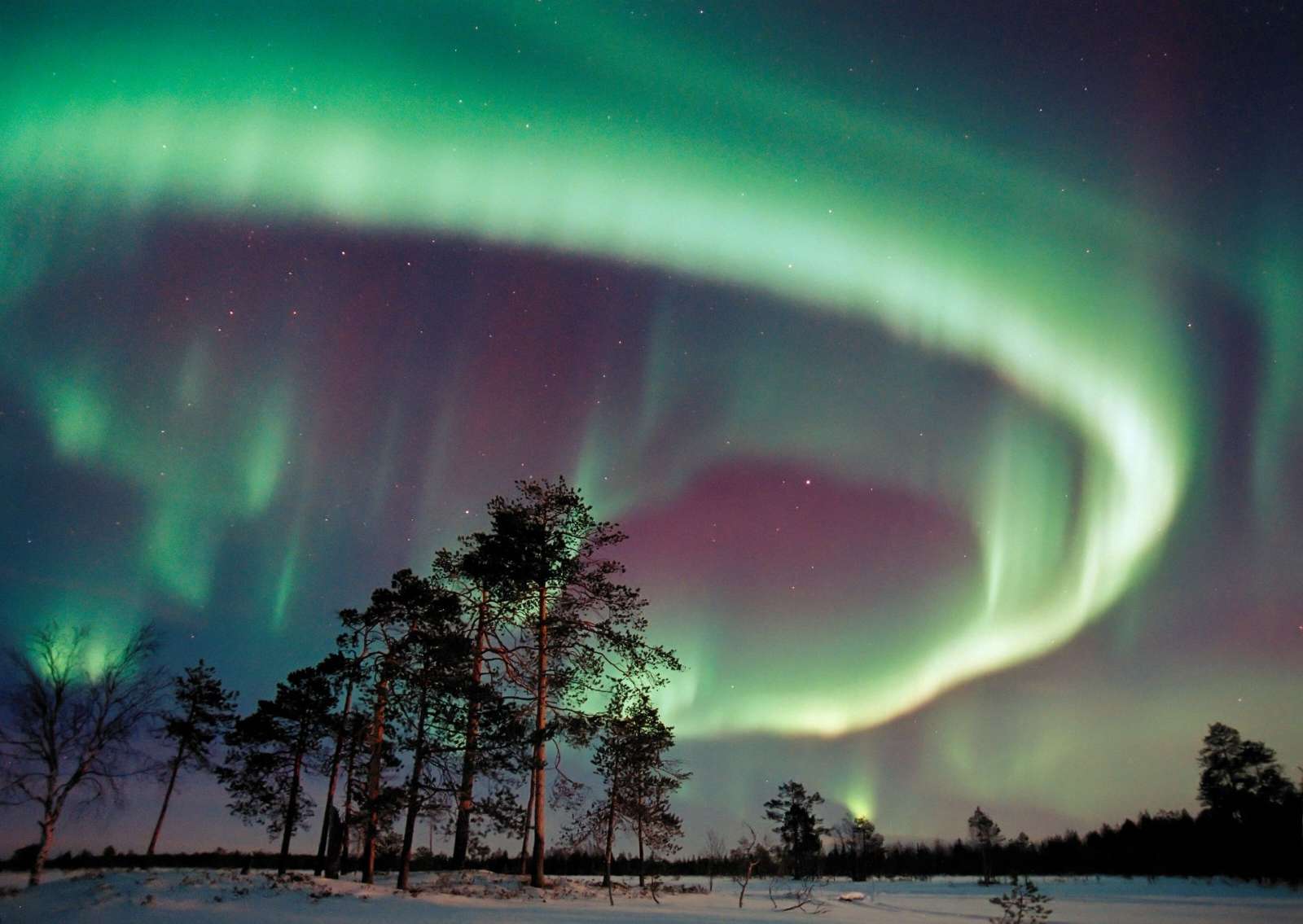 Aurora cabin reflected in a Finnish lake