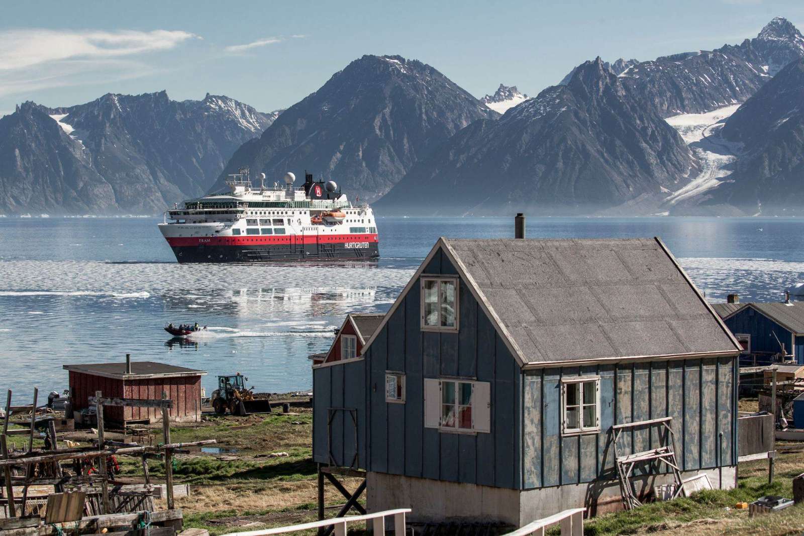 An expedition ship off an Inuit village in North Greenland