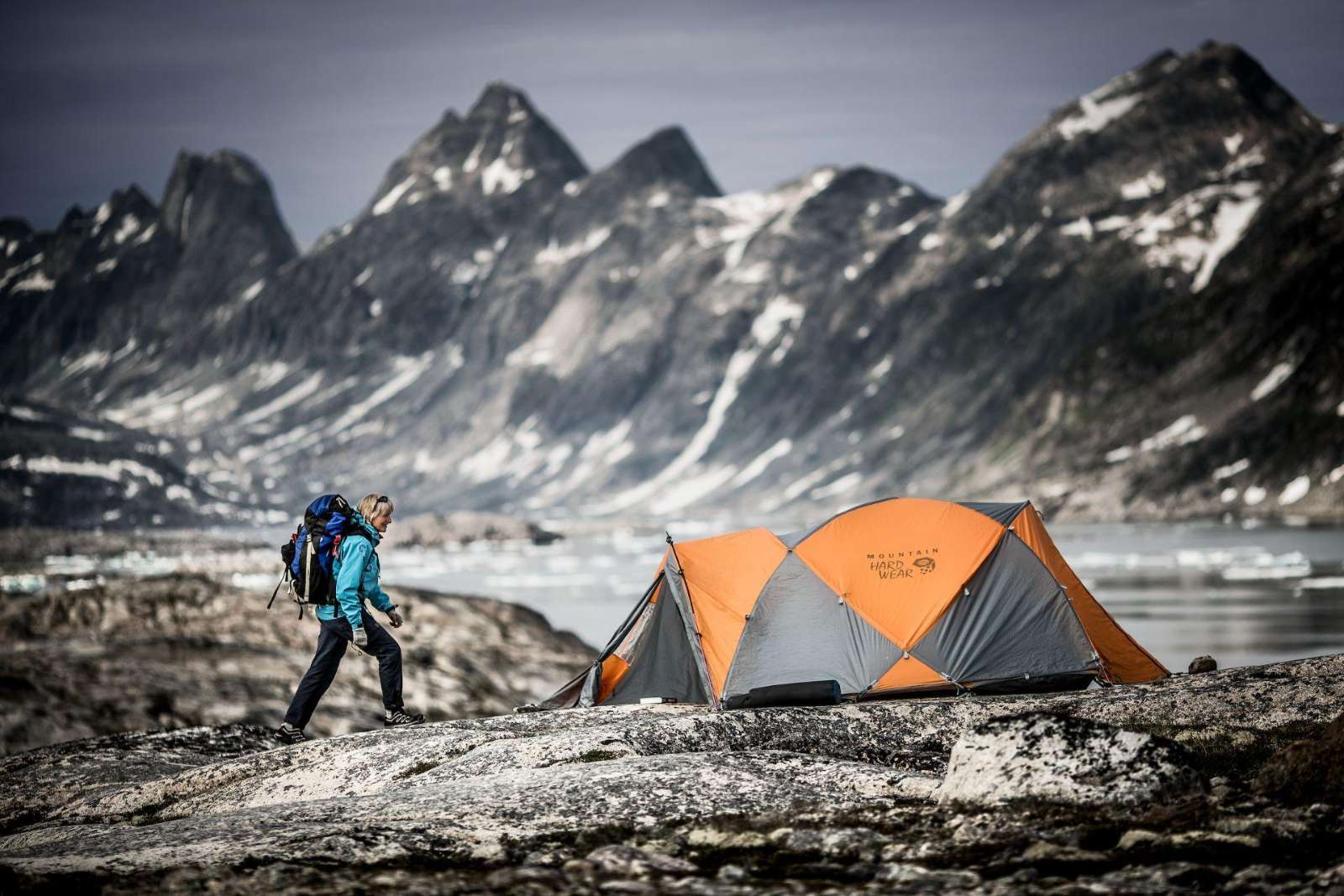 A hiker reaching a wilderness camp in East Greenland near Tasiilaq