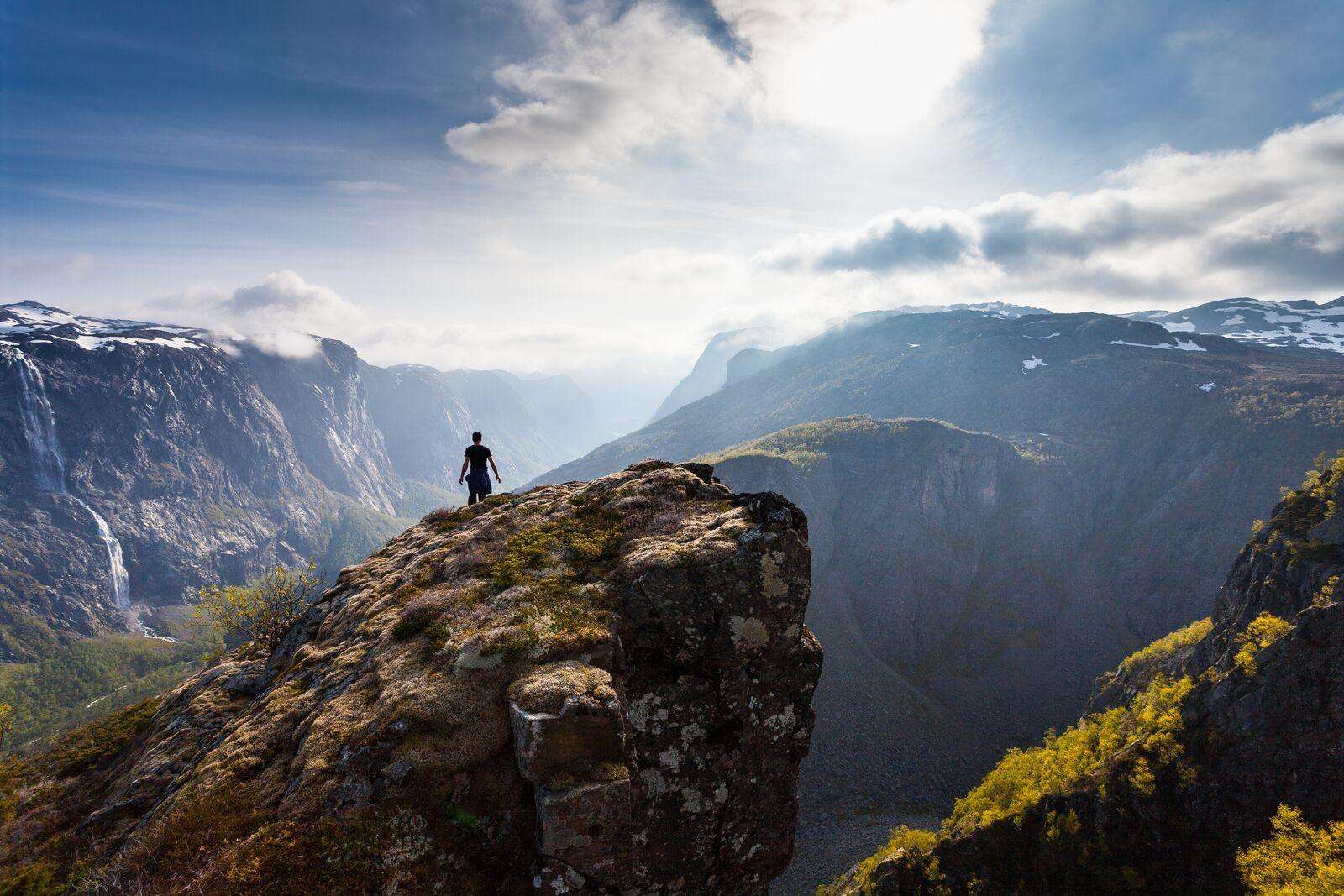 A hiker on the clifftop at Fossjuvet, Forsand, Norway