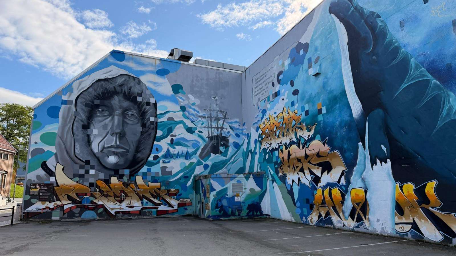 A large polar-themed mural on a building wall in Tromsø, Norway